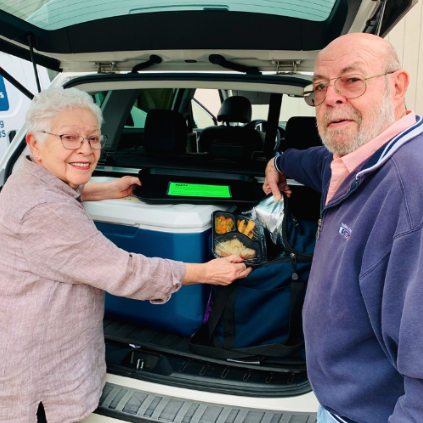 Volunteers delivering meals to seniors