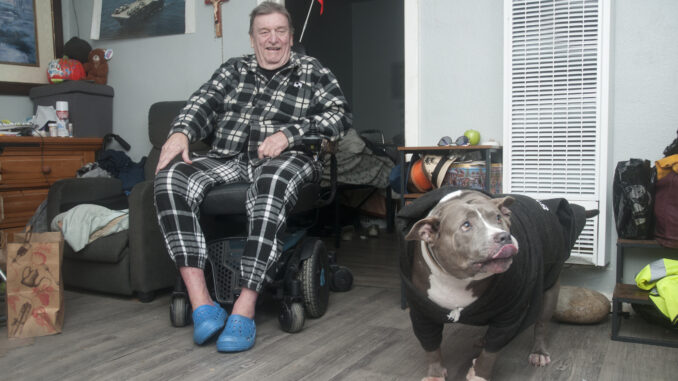 Meals on Wheels Yolo County’s MOW PAWS program benefits seniors such as Steve Pearson and his companion, Smokey, with free pet food delivered alongside ready-to-eat meals for Pearson. Photo by Anne Stokes